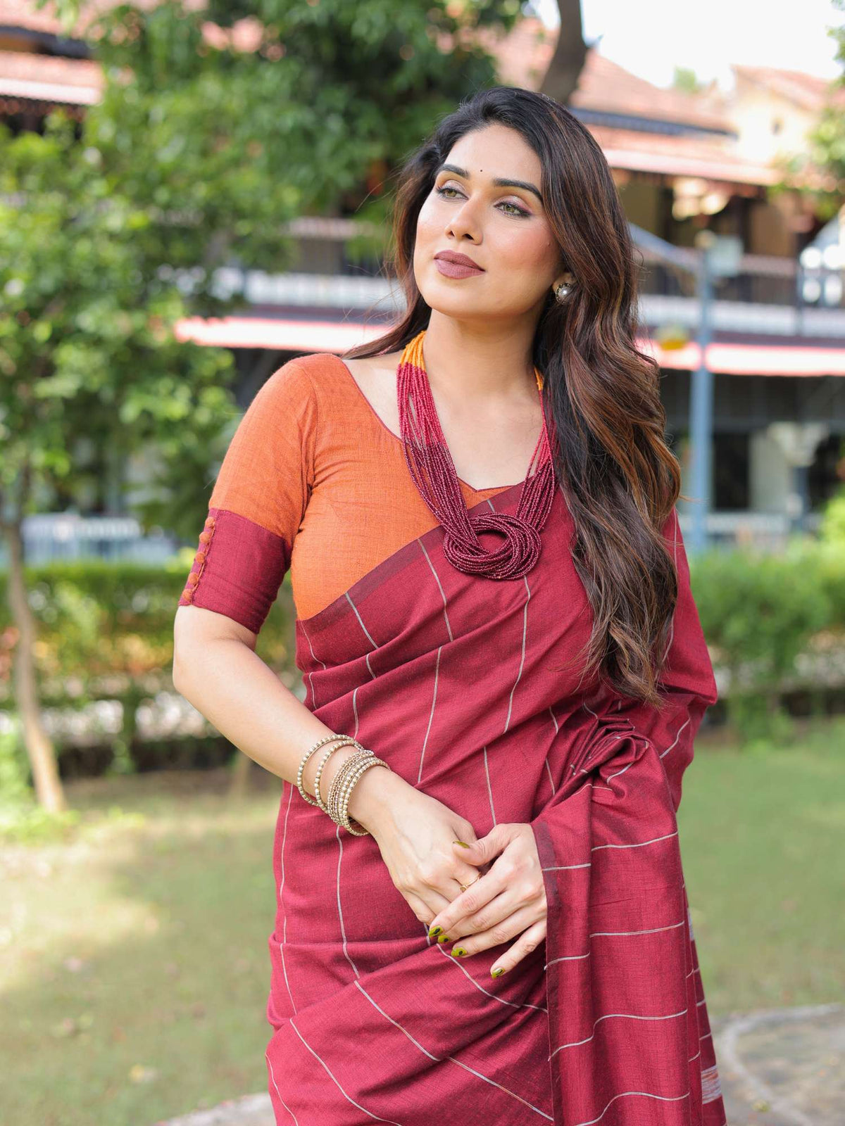 Durga cotton saree with contrast blouse.